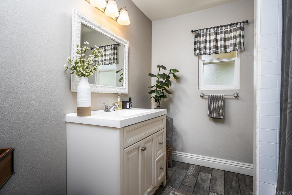 2430 Geyer Lane Alpine, CA 91901 - Photo 17 of 60 a bathroom with a sink and a mirror