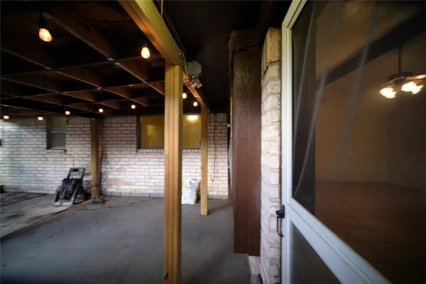a view of a hallway with seating area
