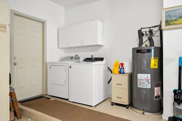 an aerial view of a house with garden space and swimming pool