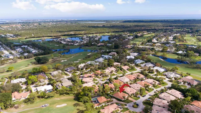 an aerial view of a house with a swimming pool outdoor seating and yard