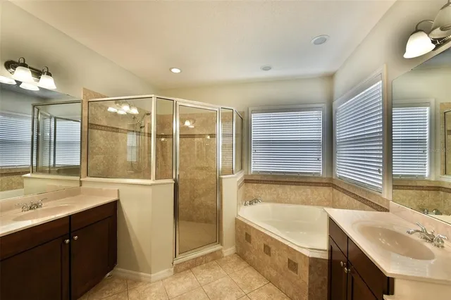 a bathroom with a granite countertop sink a mirror and a vanity