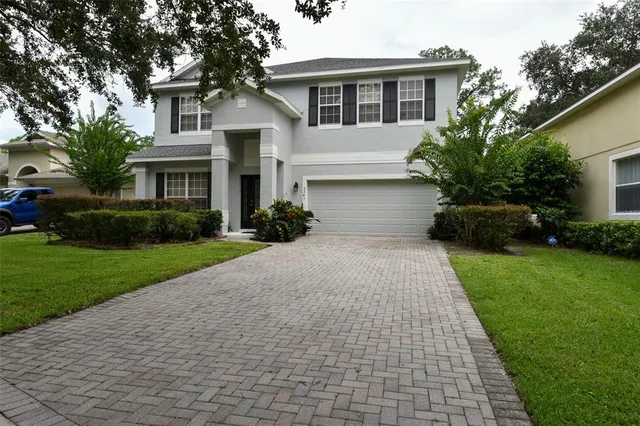 an aerial view of a house with outdoor space and lake view