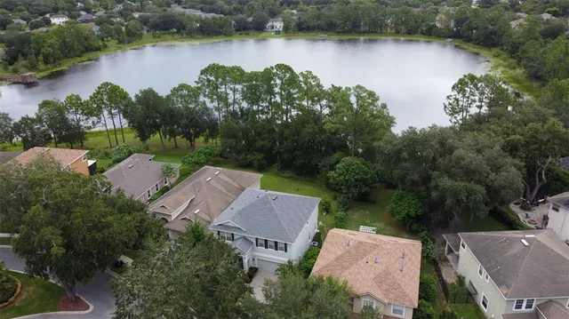 an aerial view of a house with garden space and street view