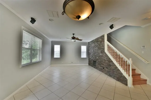 a view of a kitchen with kitchen island granite countertop a large counter top stainless steel appliances and cabinets