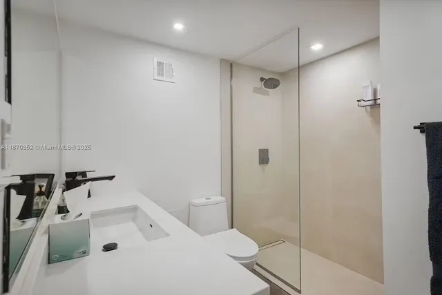 a bathroom with a tub and sink