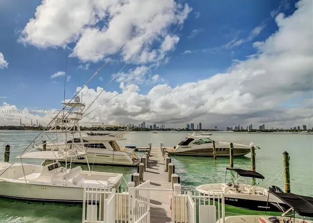 a view of a lake with tall buildings
