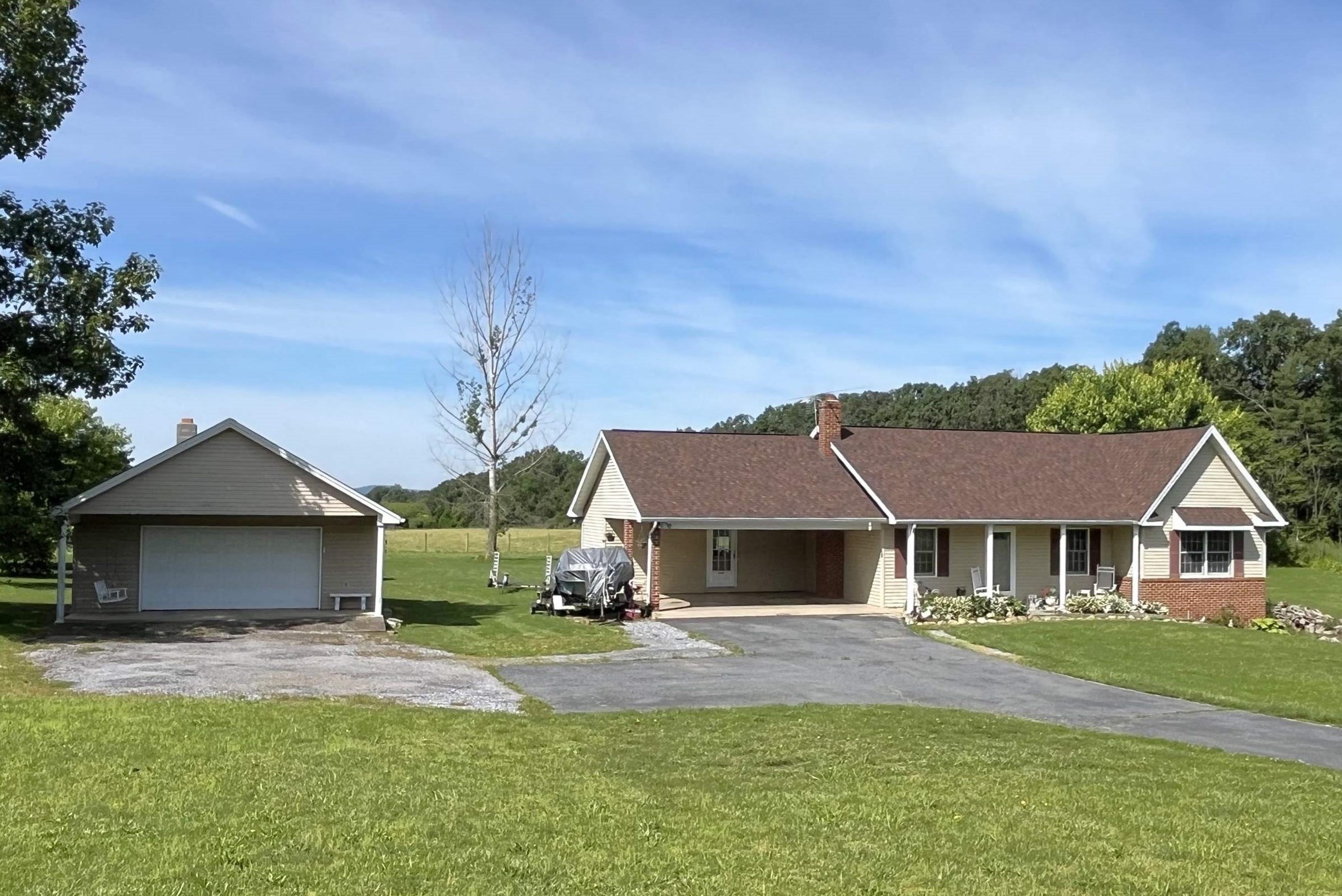 1163 Fleeburg Loop Shenandoah, VA 22849 - Photo 1 of 47 a front view of a house with a yard and garage