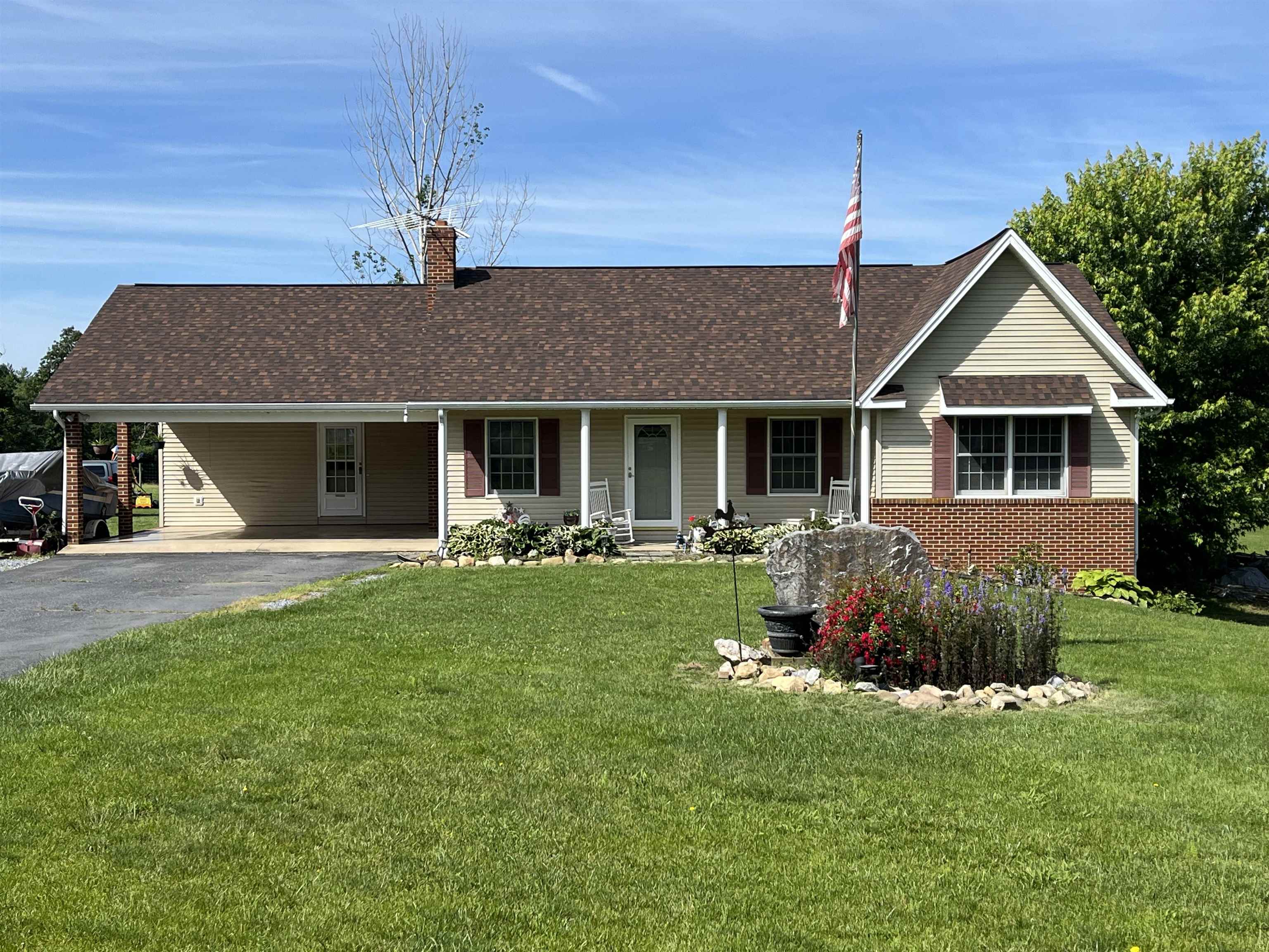 1163 Fleeburg Loop Shenandoah, VA 22849 - Photo 33 of 47 a front view of a house with a garden