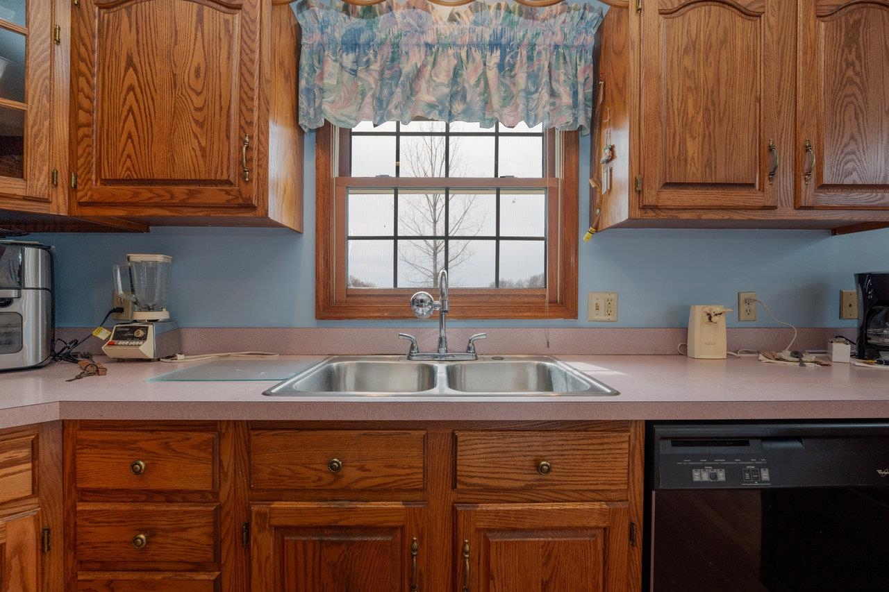 1163 Fleeburg Loop Shenandoah, VA 22849 - Photo 5 of 47 a kitchen with granite countertop a sink stainless steel appliances and cabinets