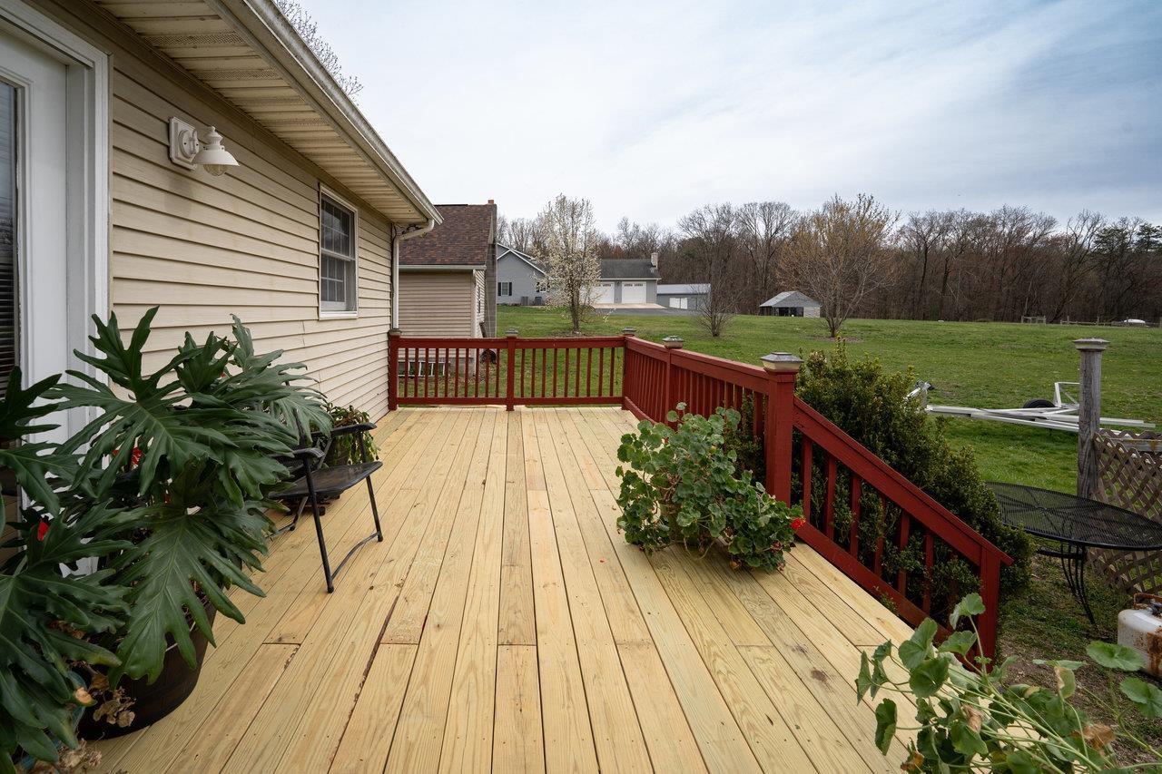 1163 Fleeburg Loop Shenandoah, VA 22849 - Photo 8 of 47 a view of a house with wooden floor and outdoor seating