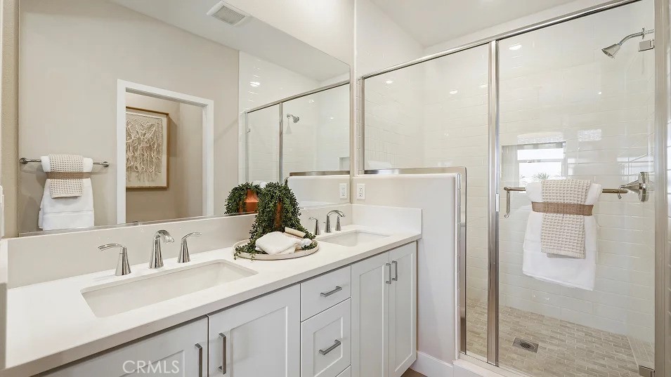 1720 East Park Lane, Unit 11 Anaheim, CA 92805 - Photo 11 of 25 a bathroom with a double vanity sink mirror and shower