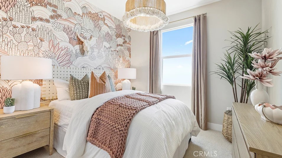 1720 East Park Lane, Unit 11 Anaheim, CA 92805 - Photo 13 of 25 a bedroom with a bed and a chandelier