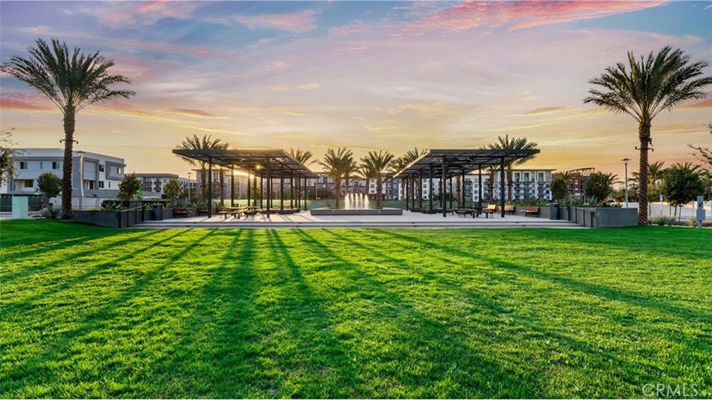 1720 East Park Lane, Unit 11 Anaheim, CA 92805 - Photo 22 of 25 a view of a yard with a palm tree