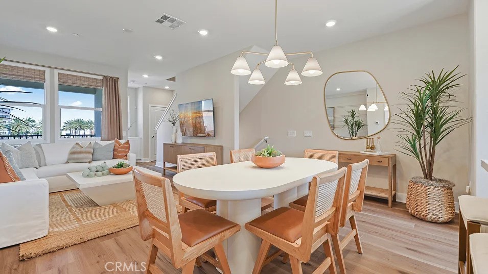 1720 East Park Lane, Unit 11 Anaheim, CA 92805 - Photo 3 of 25 a view of a dining room with furniture window and wooden floor