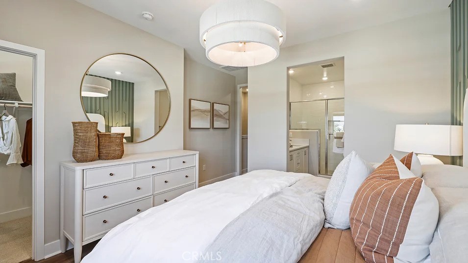 1720 East Park Lane, Unit 11 Anaheim, CA 92805 - Photo 10 of 25 a bedroom with a bed and a dresser