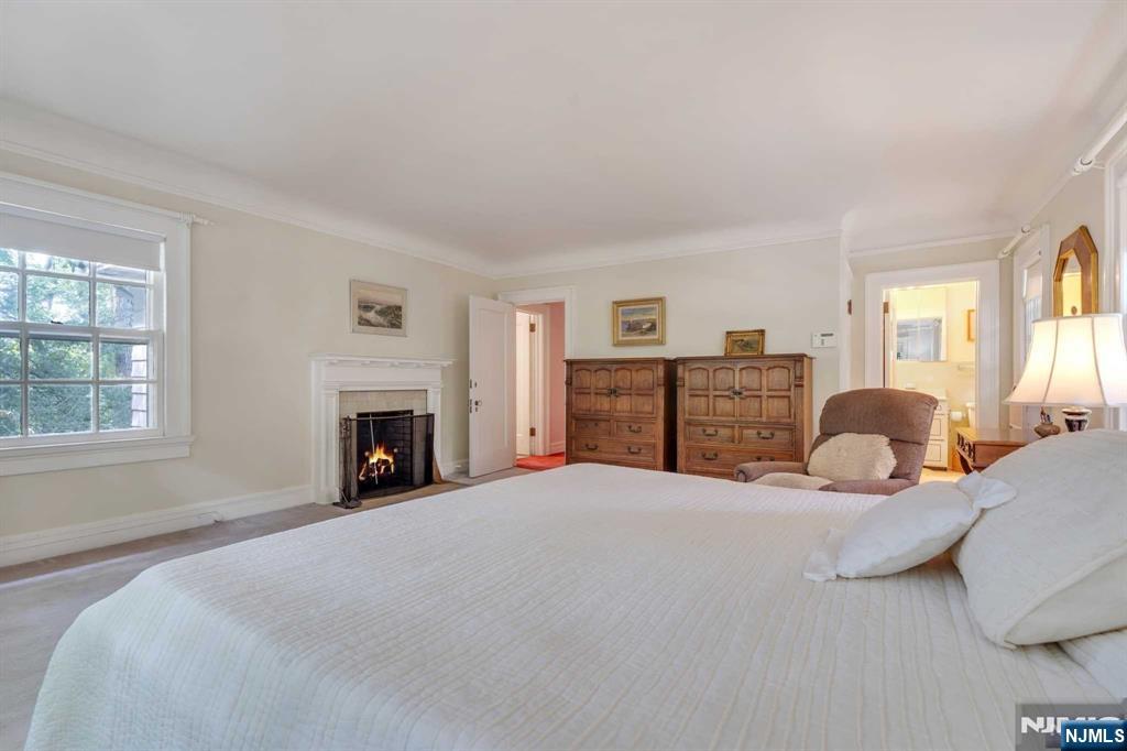 232 County Road Demarest, NJ 07627 - Photo 32 of 48 a bed room with a bed and a fireplace