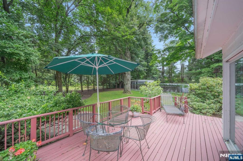 232 County Road Demarest, NJ 07627 - Photo 41 of 48 a view of deck with furniture and barbeque oven in the forest