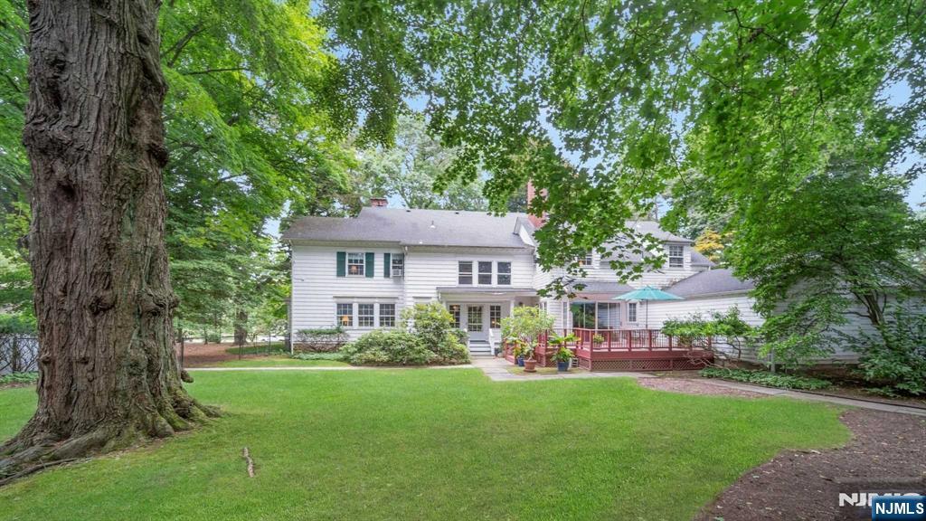 232 County Road Demarest, NJ 07627 - Photo 47 of 48 a front view of a house with a garden