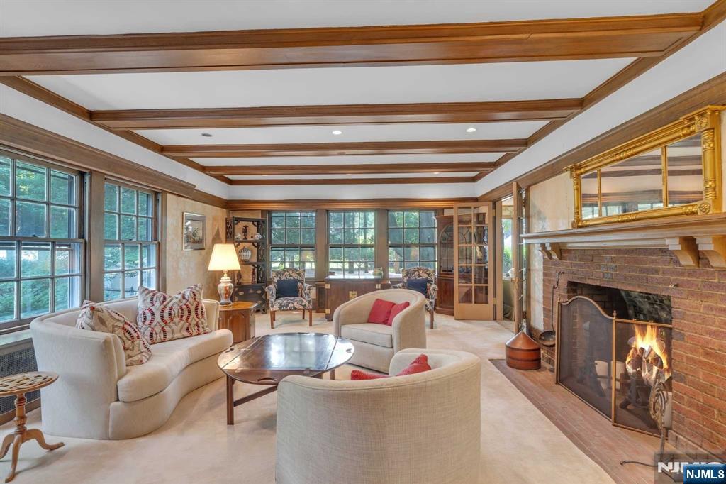 232 County Road Demarest, NJ 07627 - Photo 8 of 48 a living room with furniture and a fireplace