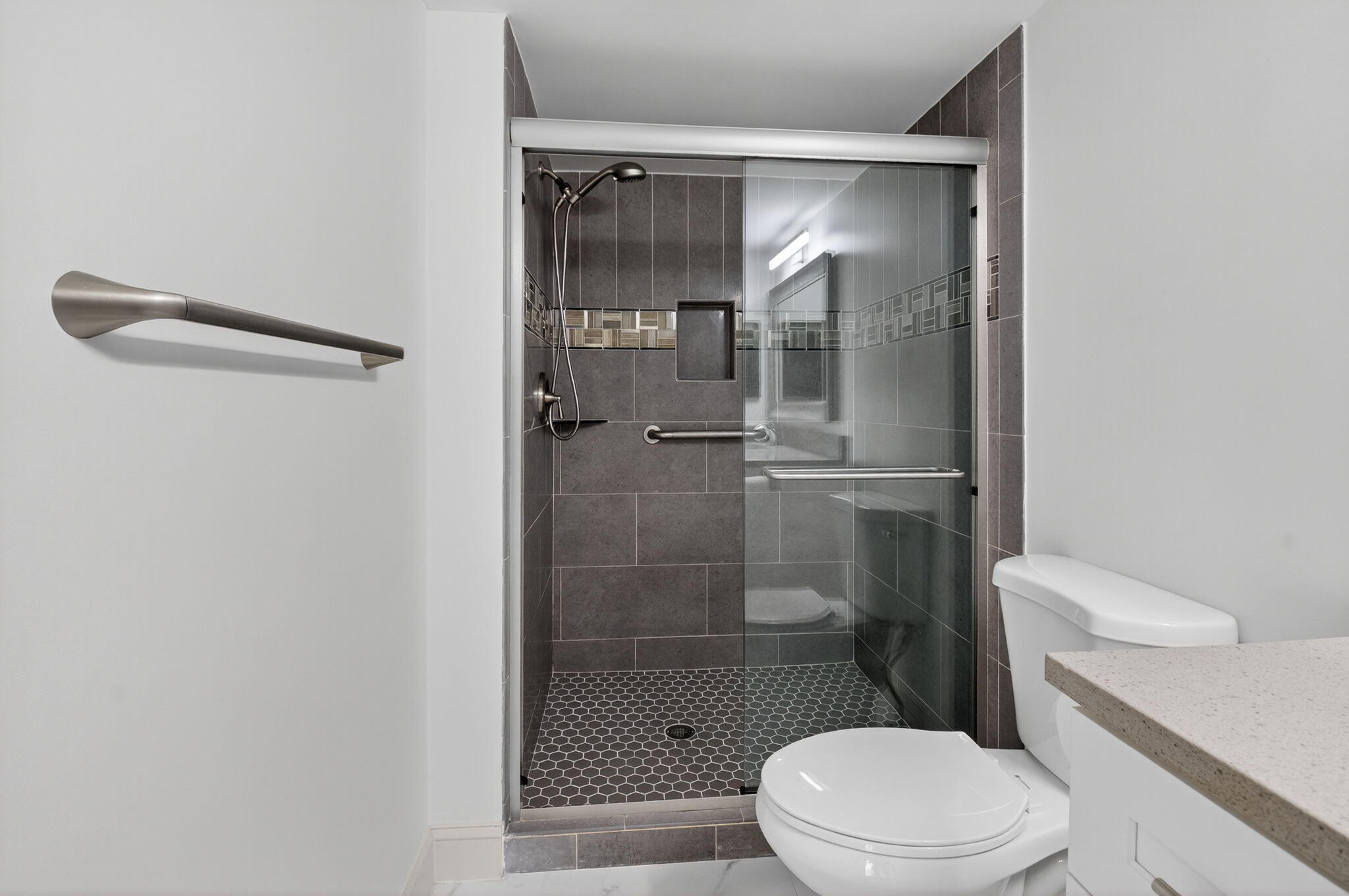 14375 Strathmore Lane, Unit 305 Delray Beach, FL 33446 - Photo 28 of 92 a bathroom with a toilet and a shower