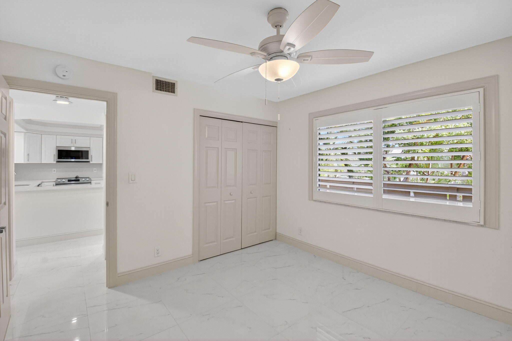14375 Strathmore Lane, Unit 305 Delray Beach, FL 33446 - Photo 34 of 92 a view of an empty room with a window