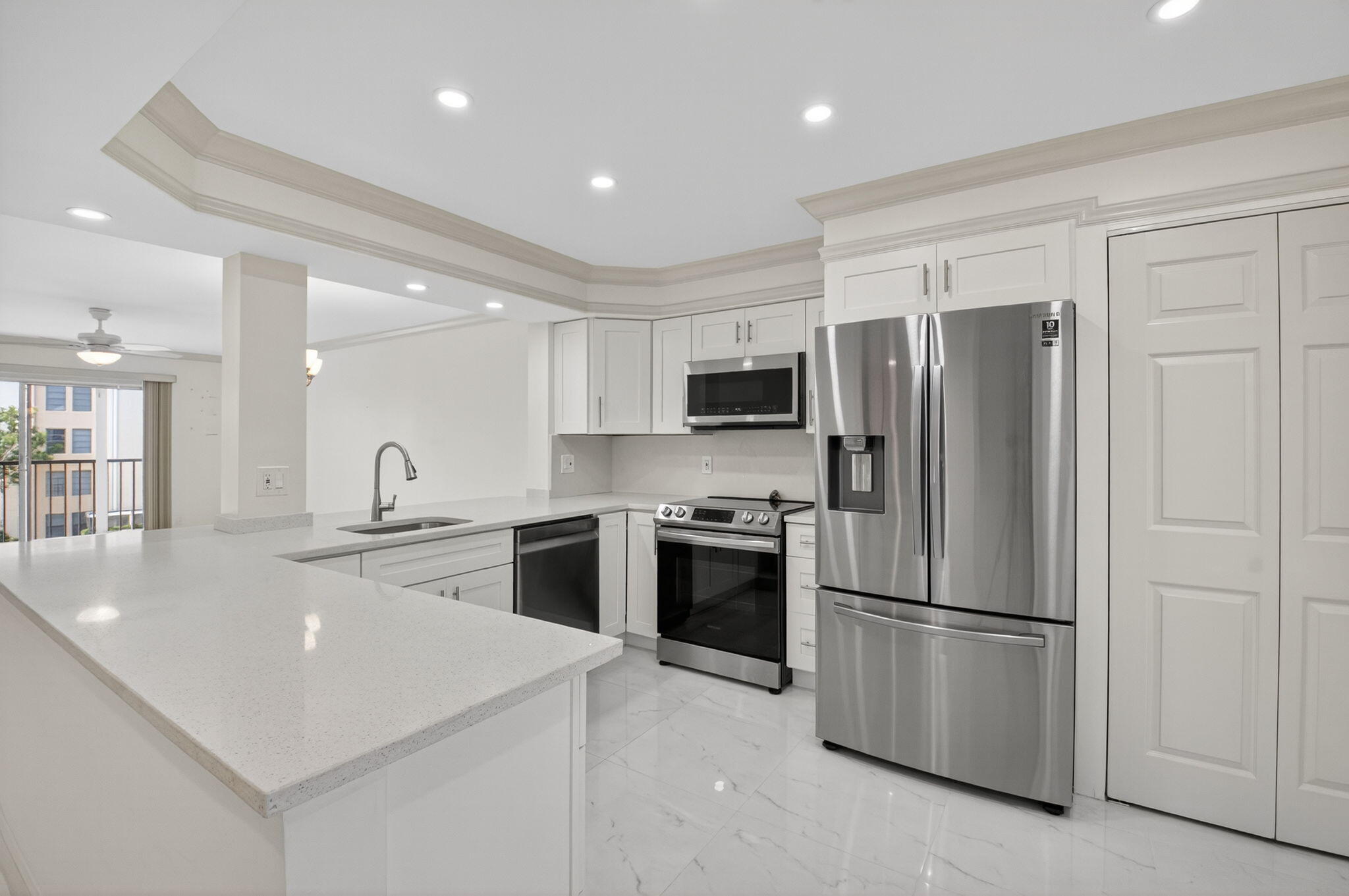 14375 Strathmore Lane, Unit 305 Delray Beach, FL 33446 - Photo 5 of 92 a kitchen with stainless steel appliances a refrigerator sink and microwave