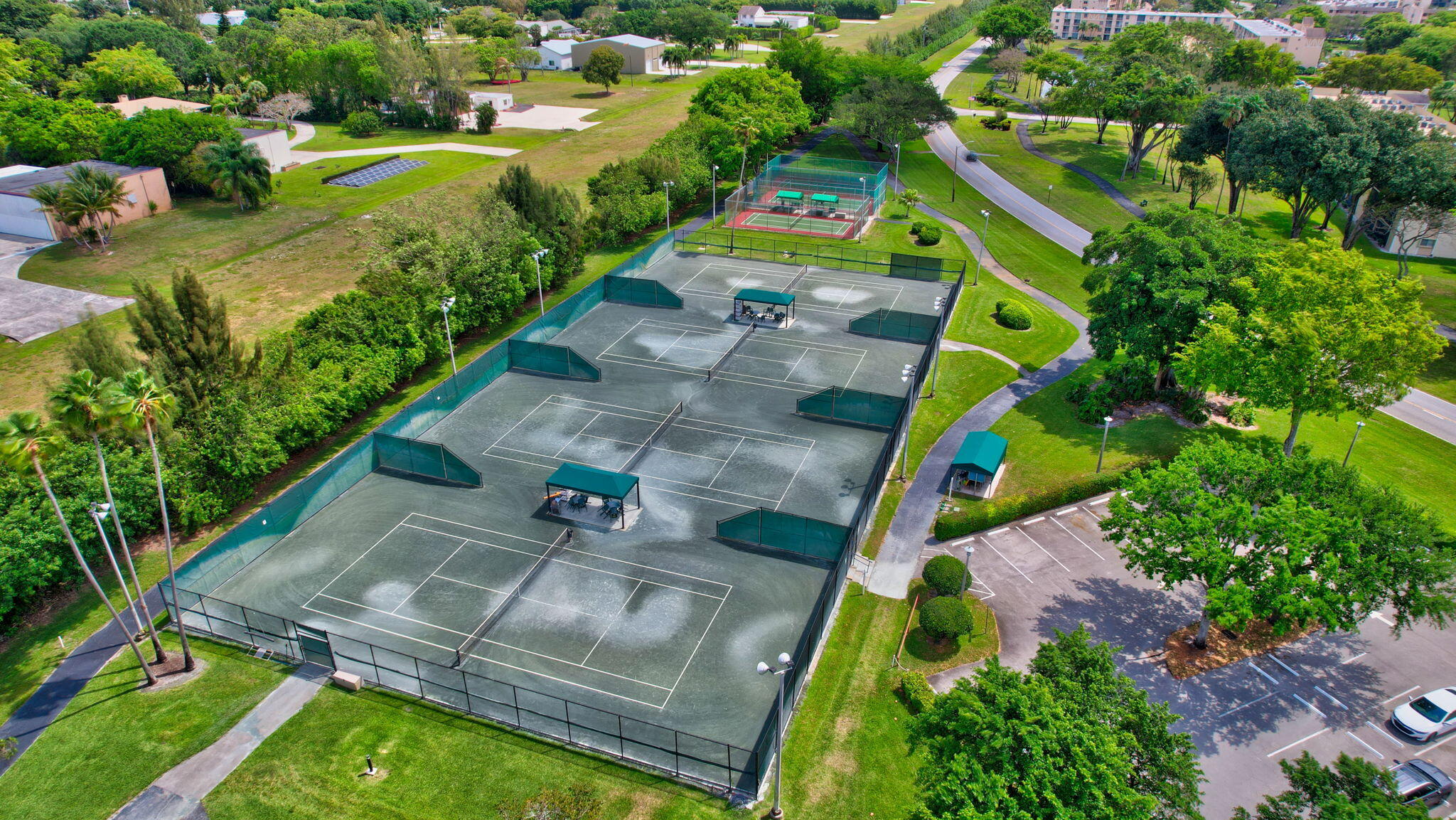14375 Strathmore Lane, Unit 305 Delray Beach, FL 33446 - Photo 58 of 92 an aerial view of a house with a yard basket ball court and outdoor seating
