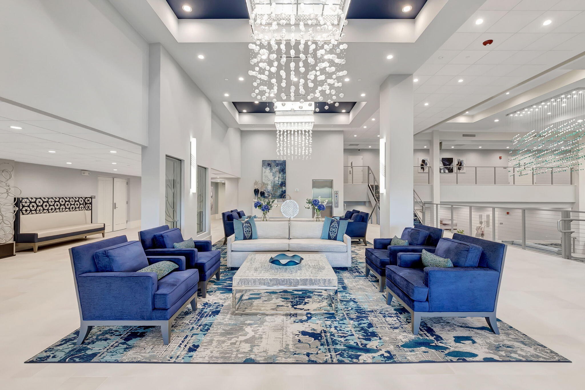 14375 Strathmore Lane, Unit 305 Delray Beach, FL 33446 - Photo 68 of 92 a living room with furniture a chandelier and a chandelier