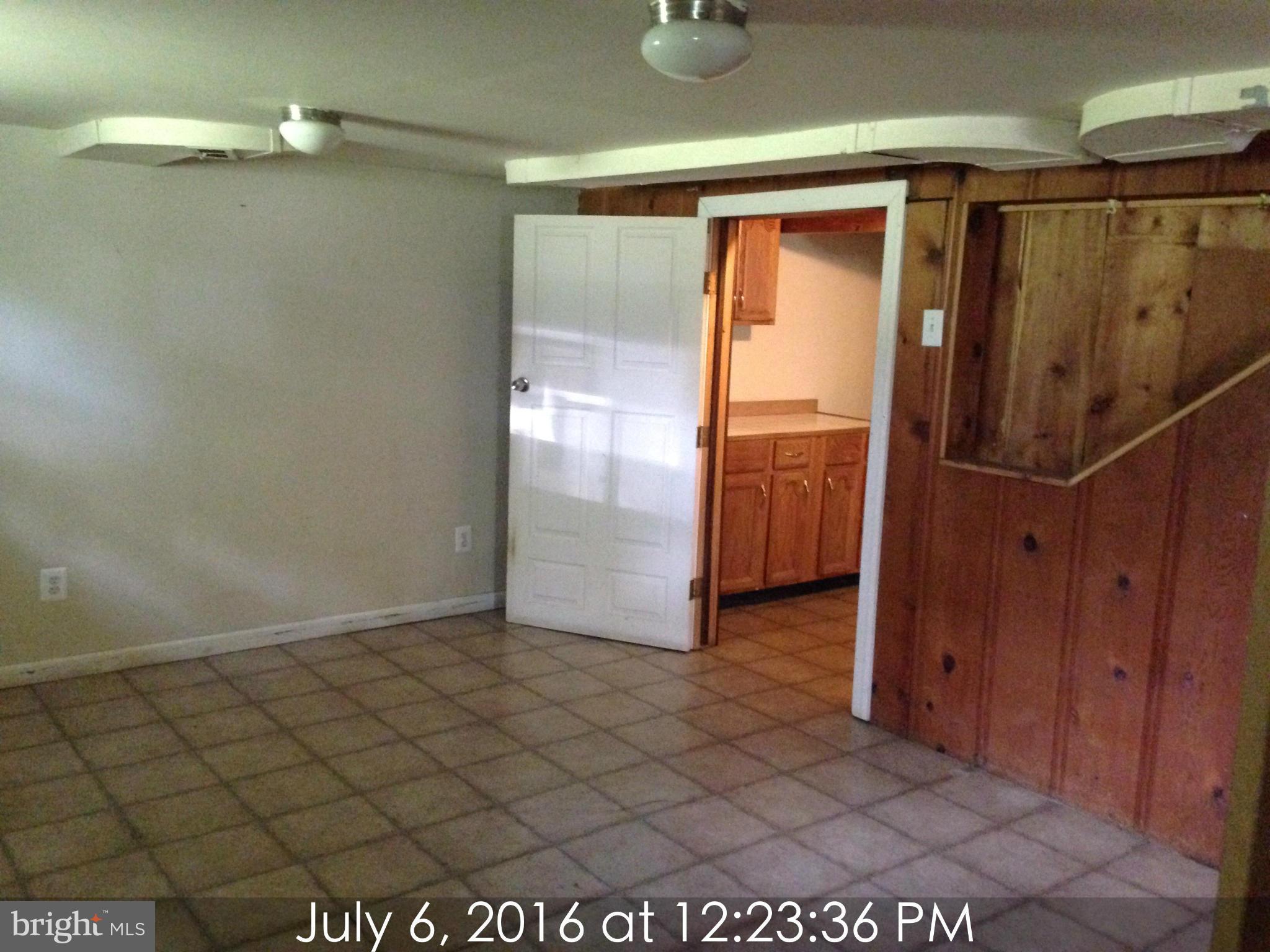 3715 Buckingham Road Baltimore, MD 21207 - Photo 6 of 9 a view of a room with door