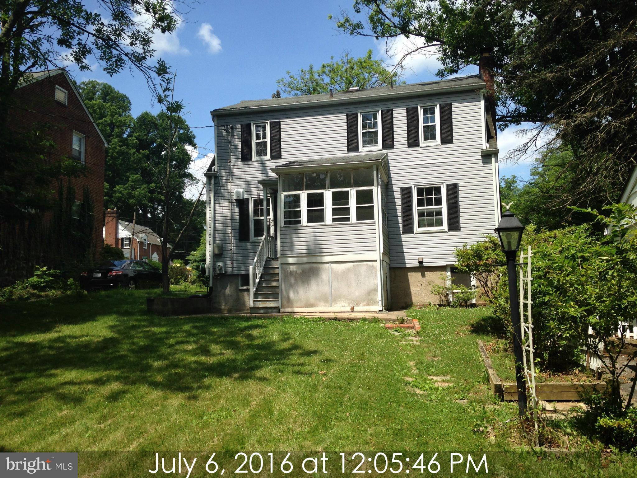 3715 Buckingham Road Baltimore, MD 21207 - Photo 9 of 9 a front view of a house with a yard