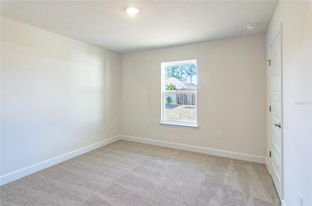 2 Seckel Court Palm Coast, FL 32164 - Photo 16 of 26 an empty room with a window