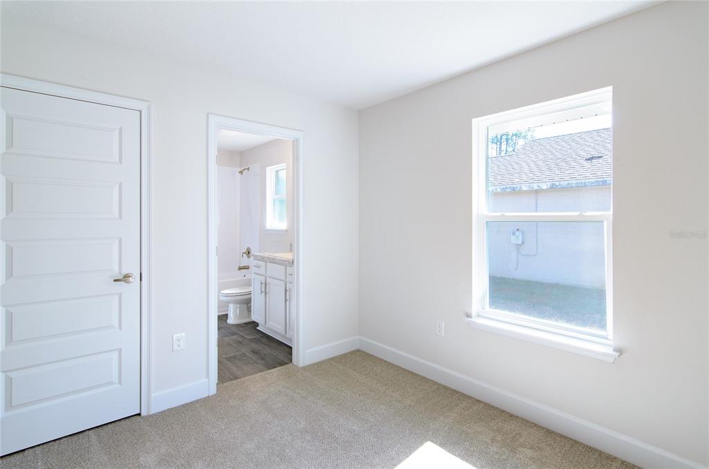 2 Seckel Court Palm Coast, FL 32164 - Photo 19 of 26 an empty room with a bathroom and a window
