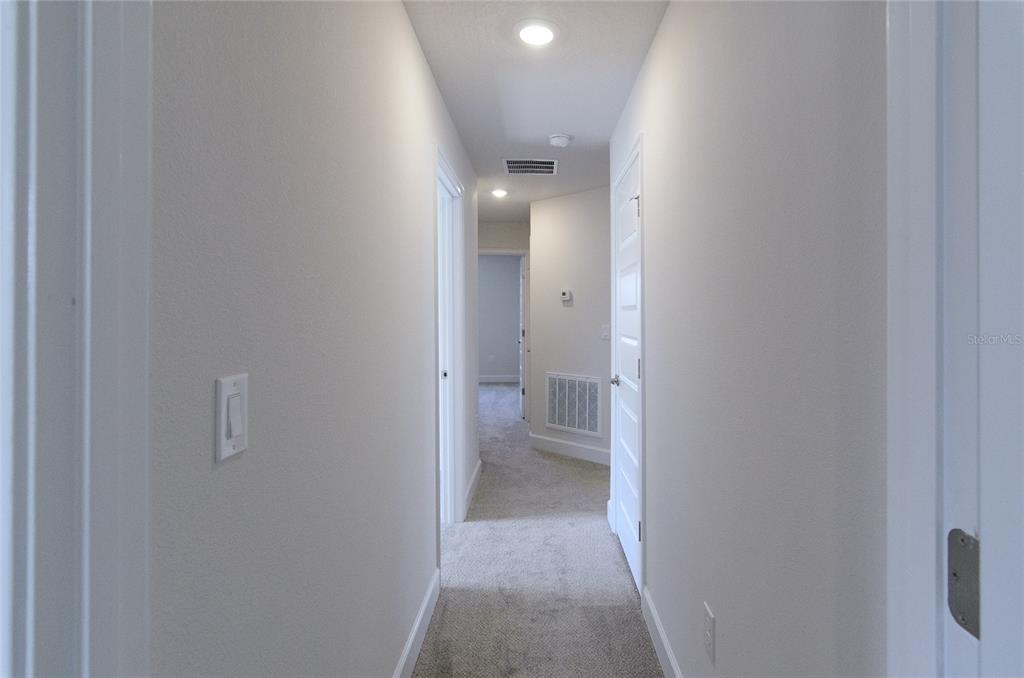 2 Seckel Court Palm Coast, FL 32164 - Photo 20 of 26 a view of a bathroom from a hallway