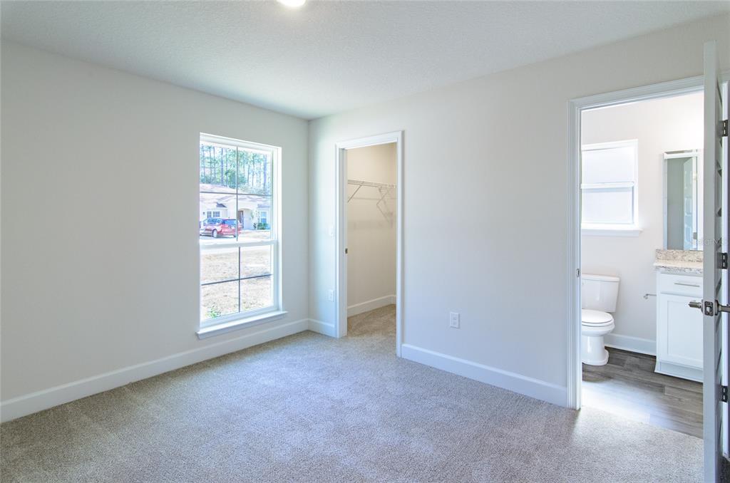 2 Seckel Court Palm Coast, FL 32164 - Photo 22 of 26 an empty room with windows and closet