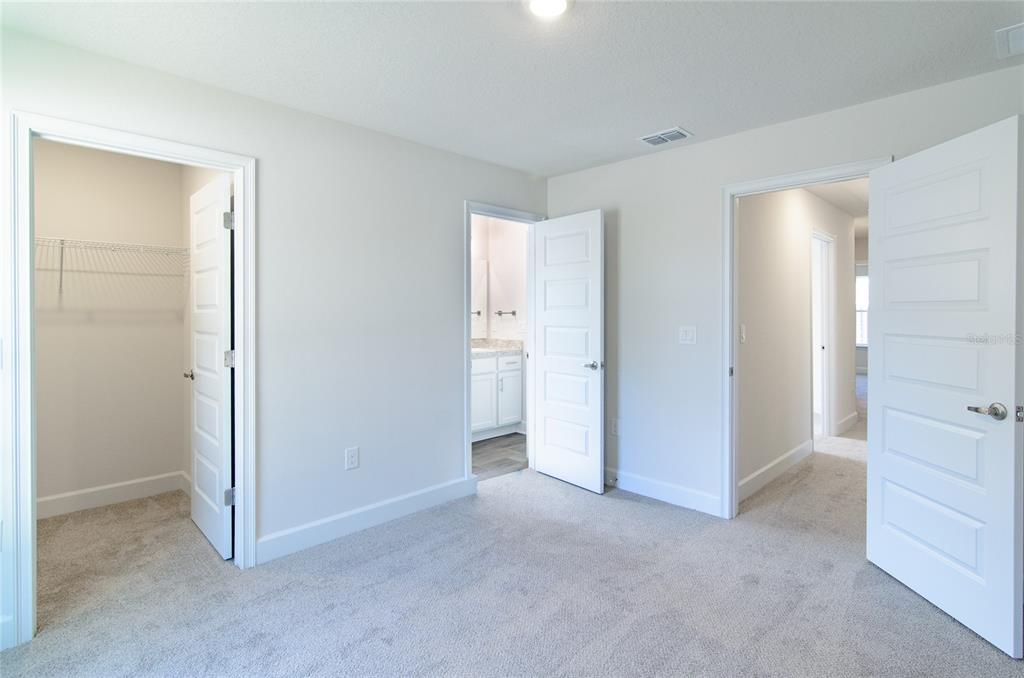 2 Seckel Court Palm Coast, FL 32164 - Photo 23 of 26 a view of an empty room with closet and a window