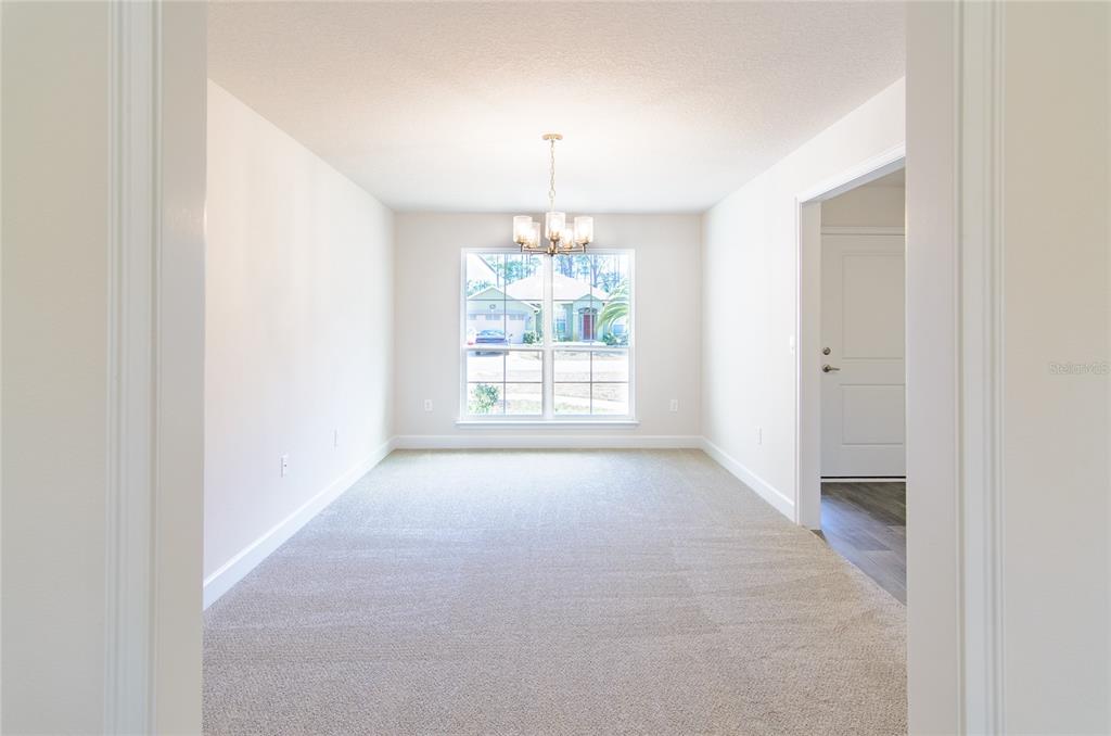2 Seckel Court Palm Coast, FL 32164 - Photo 5 of 26 a view of an empty room with a window