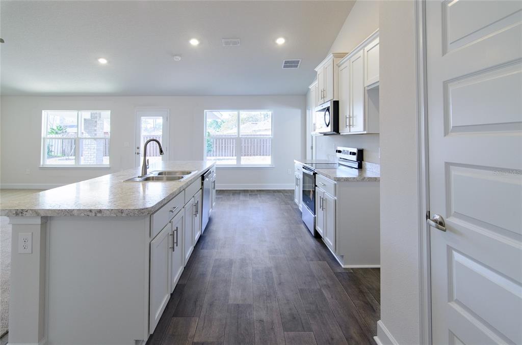 2 Seckel Court Palm Coast, FL 32164 - Photo 6 of 26 a kitchen with counter top space sink and center