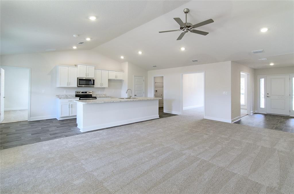2 Seckel Court Palm Coast, FL 32164 - Photo 8 of 26 a view of a kitchen with a sink and a stove top oven