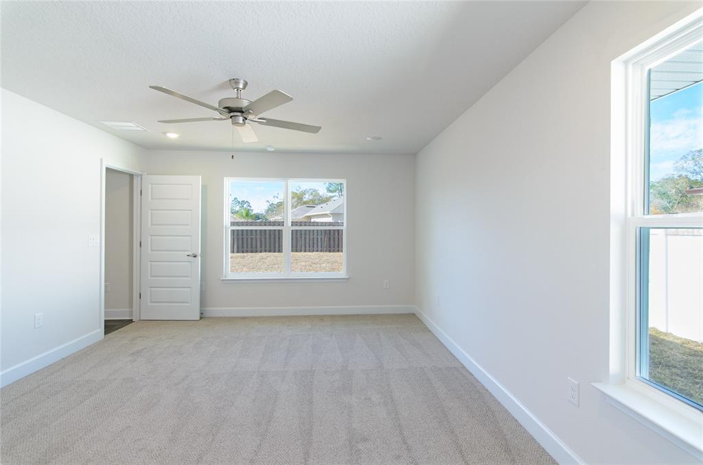 2 Seckel Court Palm Coast, FL 32164 - Photo 10 of 26 a view of an empty room with a window