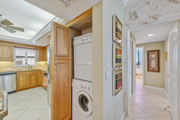 a view of a kitchen with refrigerator and washer