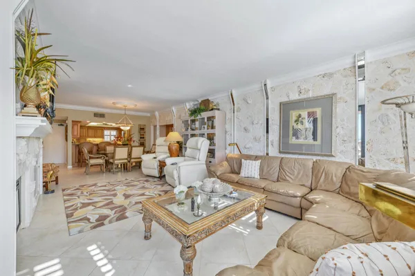 a living room with furniture a couch and a dining table