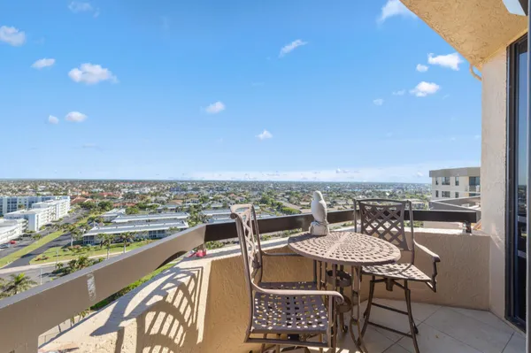 a view of a balcony with an ocean view