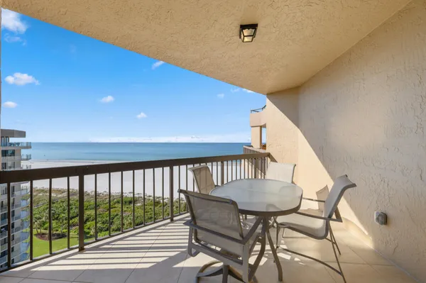 a view of balcony with furniture