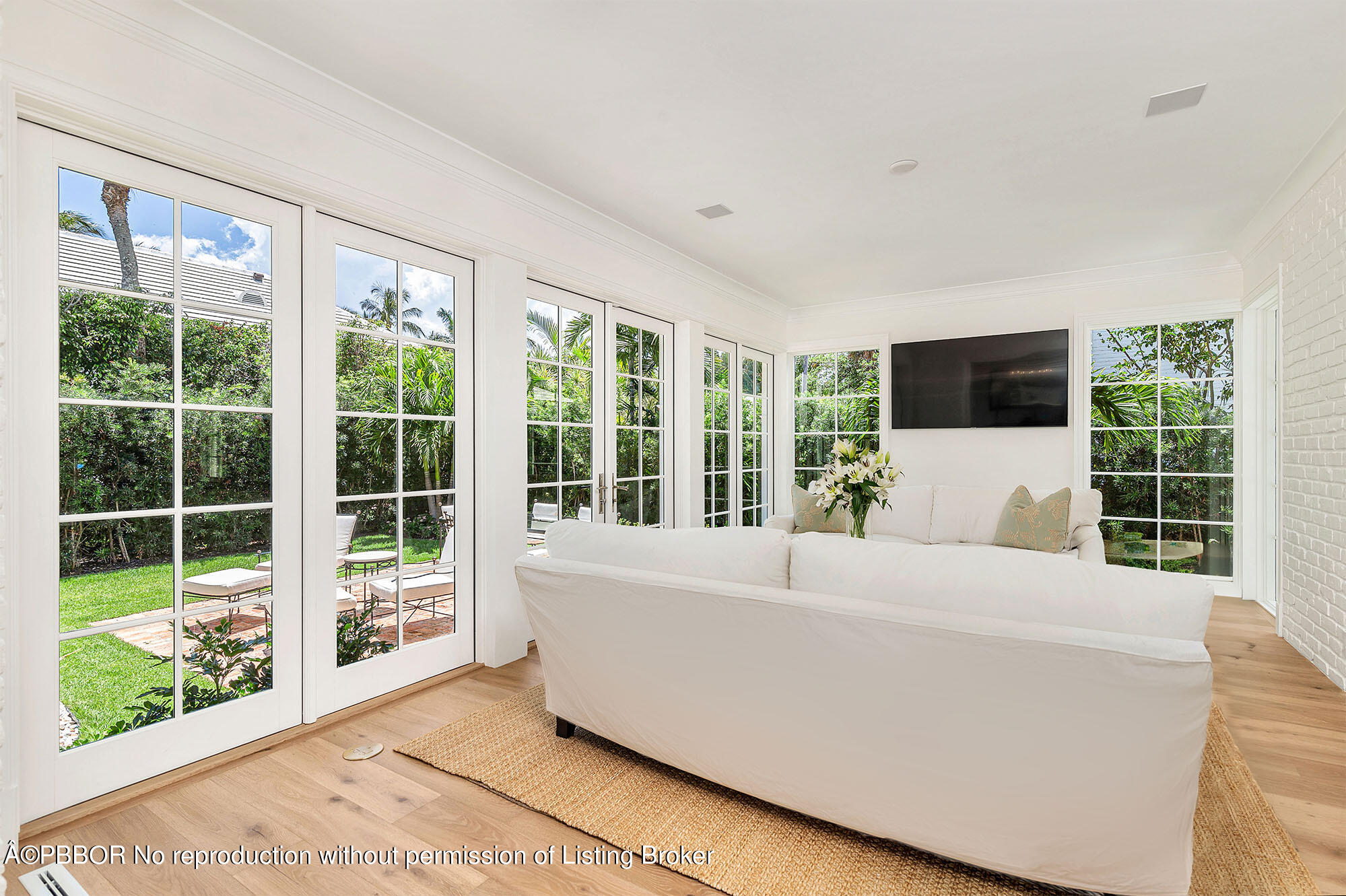 236 Pendleton Avenue Palm Beach, FL 33480 - Photo 15 of 35 a living room with a large window and a couch