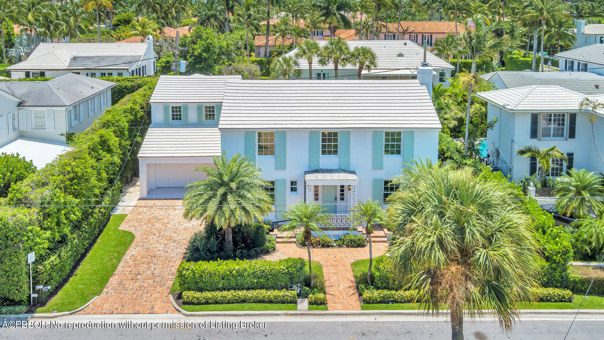 236 Pendleton Avenue Palm Beach, FL 33480 - Photo 34 of 35 a front view of a house with a yard and trees