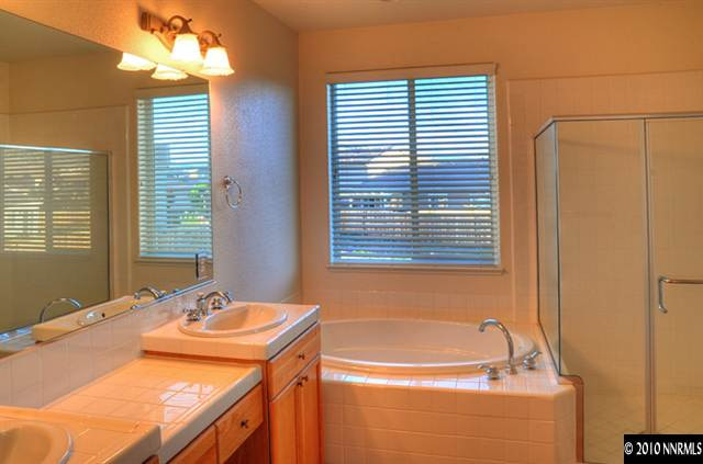 2530 7 Pines Court Reno, NV 89521 - Photo 8 of 9 a bathroom with a tub and a sink