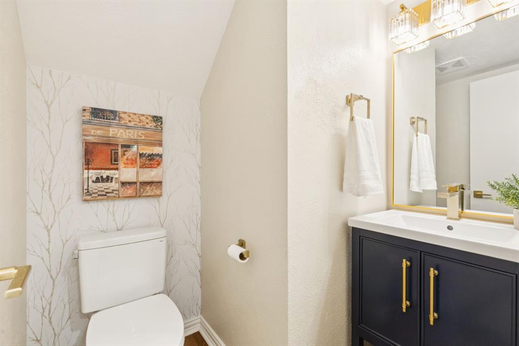 2016 Via Miramonte Carrollton, TX 75006 - Photo 16 of 34 a bathroom with a sink a toilet and mirror