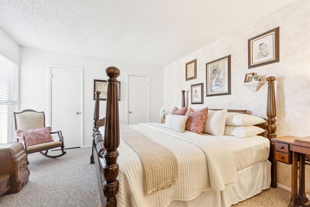 2016 Via Miramonte Carrollton, TX 75006 - Photo 20 of 34 a bedroom with a bed and chair