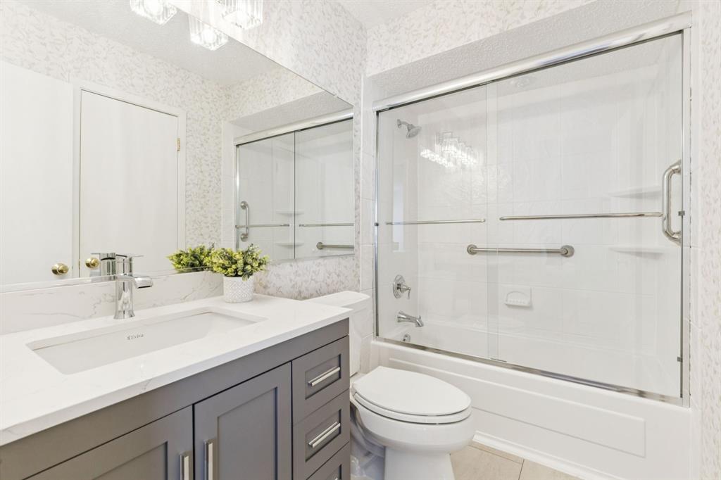 2016 Via Miramonte Carrollton, TX 75006 - Photo 23 of 34 a bathroom with a sink toilet and shower