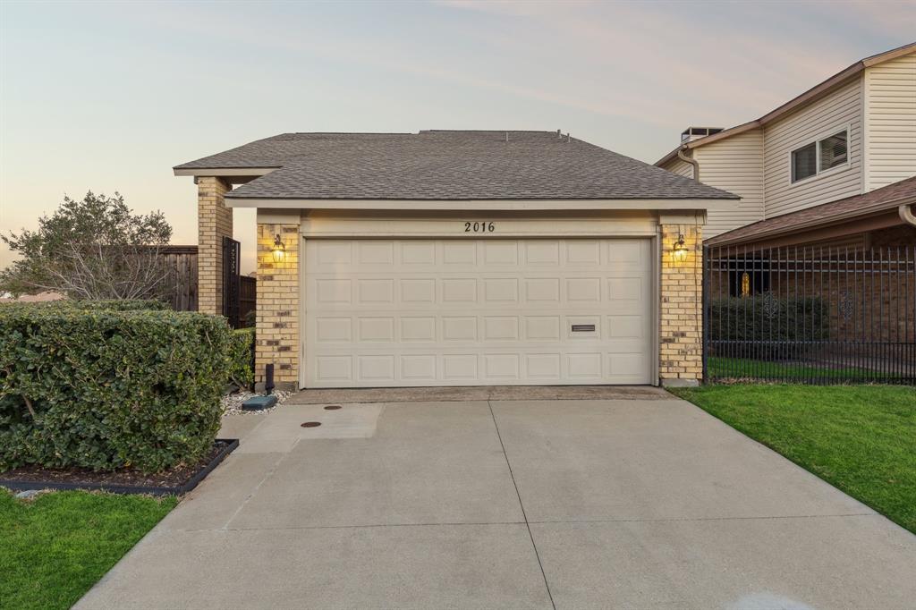 2016 Via Miramonte Carrollton, TX 75006 - Photo 34 of 34 a front view of a house with garden